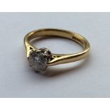 A large diamond single stone mounted as a ring in