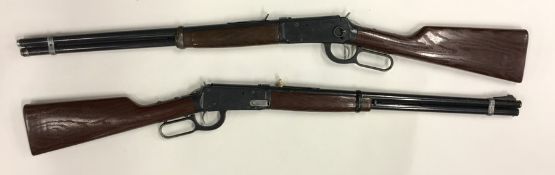 Two child's spring mounted toy rifles by Daisy MFG