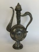A massive Islamic silver ewer with lift-off cover,