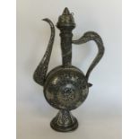 A massive Islamic silver ewer with lift-off cover,