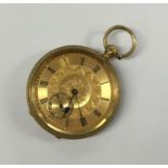 A heavy 18 carat engraved fob watch decorated with