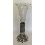 A massive German silver and glass vase profusely d