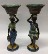 A good pair of pottery Blackamoor figures in blue