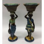 A good pair of pottery Blackamoor figures in blue