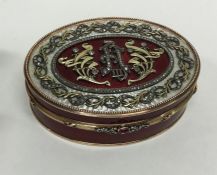 A good quality oval gold and enamelled box attract