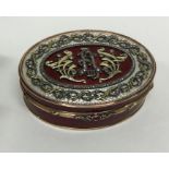 A good quality oval gold and enamelled box attract