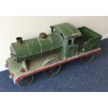 A handmade child's model of a locomotive in green,