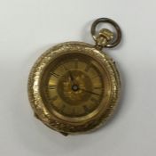 A small gold and enamelled fob watch with gilt dia