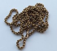 A large 9 carat long guard chain. Approx. 52 grams