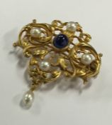 A good French 18 carat sapphire and pearl brooch w