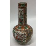 A Canton baluster shaped vase decorated with flowe