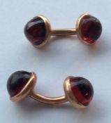 A pair of 9 carat cufflinks inset with cabochon st
