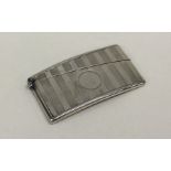 A silver engine turned card case with hinged top.