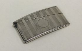 A silver engine turned card case with hinged top.