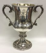 A large Indian silver two handled trophy cup decor