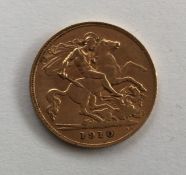 A 1910 half sovereign. Est. £70 - £90.