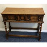 An oak single drawer hall table with barley twist