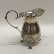 A small silver cream jug with card cut rim. Birmin