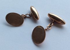 A pair of 10 carat gold cufflinks with engine turn