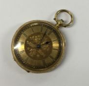 A lady's 18 carat open face fob watch with gilt di
