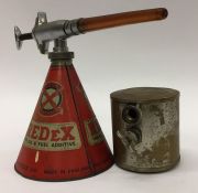 A "Redex" metal canister together with a conical s