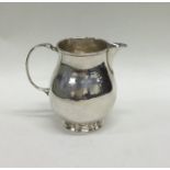 A George I silver sparrow beak cream jug on pedest