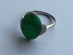 A good jade ring attractively decorated with scrol