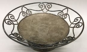 An Edwardian silver sweet dish decorated with scro