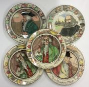 Eleven Royal Doulton plates decorated with Charles