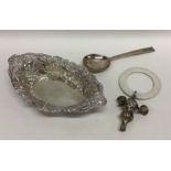 A small silver bonbon dish together with a rattle