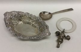 A small silver bonbon dish together with a rattle