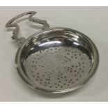 A Scottish Georgian silver lemon strainer with scr