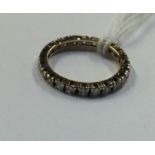 A diamond full eternity ring in yellow gold. Est.