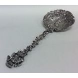 An attractively embossed silver preserve spoon wit