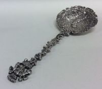 An attractively embossed silver preserve spoon wit