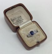 An attractive French platinum, sapphire and diamon
