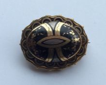 A piqué oval Victorian target brooch with rope twi