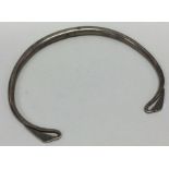 An unusual Continental silver bangle with engraved