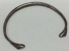 An unusual Continental silver bangle with engraved