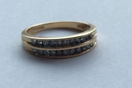 A 9 carat diamond two row ring. Approx. 3 grams. E