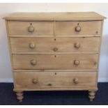 A pine chest of six drawers on turned supports. Es