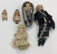 A small collection of porcelain headed dolls. Est.