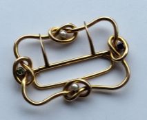 SUFFRAGETTE: A rare gold buckle of knot decoration
