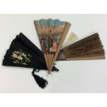 A group of four painted fans mounted with tassels.