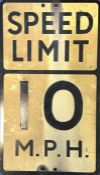 A rectangular metal "Speed Limit 10 M.P.H" sign. A