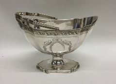 A Georgian silver bright cut swing handled basket
