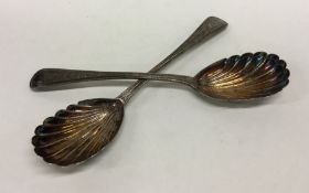 A pair of silver aesthetic salad servers with flut