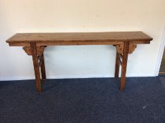 A massive Chinese altar table with scroll decorati