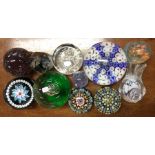 A group of glass paperweights. Est. £15 - £20.