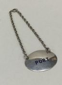 An oval Edwardian silver Port label on suspension